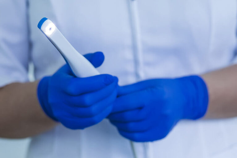 Doctor holding Intraoral Camera