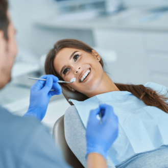 Patient receiving professional teeth cleaning during a routine dental visit at South Peek Dental Care.